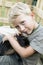 Boy cuddling up with pet rabbit