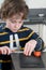 Boy cutting tomato