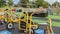 A boy cycles his bike around a school park playground