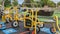 A boy cycles his bike around a school park playground during break time