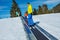 Boy and a dad look back standing on the ski moving walkway