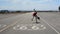 Boy dancing breakdance in the famous route 66 road