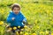 Boy in dandelion field