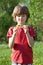 Boy with dandelion in the hands of