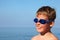 Boy in dark blue glasses for swimming