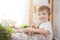 Boy decorate easter egg. A little boy painting and decorating Easter eggs. Portrait of cute boy 3 years old. He holds