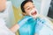 Boy in a dental cabinet, caries removal