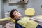 Boy on the dentist chair showing braces