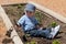 Boy digging in dirt