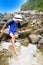 Boy dipping his toes in a rockpool