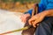 Boy with disabilities riding horse at equestrian center with male instructor.