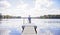 Boy on dock looking in lake