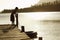 Boy On Dock Pulling In Float Tube