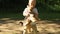 Boy with a dog in nature. little boy walking with a cute Yorkshire terrier dog in the park