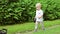 Boy with a dog in nature. little boy walking with a cute Yorkshire terrier dog in the park