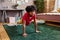 Boy doing physical exercises at home