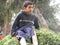 Boy on a donkey in a farm, rural life