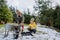 Boy with Down syndrome with his grandmother clearing snow in garden.