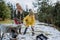 Boy with Down syndrome with his mother clearing snow from path with shovel in front of house.