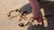 Boy draws his finger on the sand near the sea. Sea vacation for family with kids. Little boy running on tropical beach