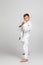 Boy dressed in a white karate kimono