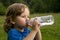 Boy Drinking Bottled Water.
