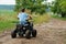 Boy drive four-wheller ATV quad bike