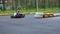 Boy drive go kart on outdoor track