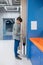 A boy drying hands in a school toilet