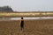 Boy in dryland looking at drought landscape. Concept for climate change from global worming.