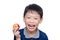 Boy eating an apple over white