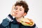 Boy eating big sandwich