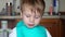 Boy eating boiled corn