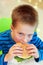 Boy eating burger