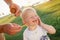 Boy eating ice cream, dirty face, green meadow, sunny