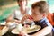 Boy eating Macaroni dessert