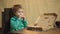 Boy eating pizza on a wooden background. Tasty pizza. Little boy having a slice of pizza. Hungry child taking a bite