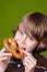 Boy eating a soft pretzel