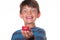 Boy eating strawberry with a goofy face