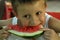 Boy eats melon