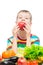 The boy eats a red juicy apple, portrait on a white