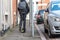 Boy on electrical scooter driving to British school in UK