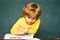 Boy from elementary school at the school yard. School lessons. Great study achievement. Kids from primary school.