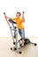 Boy on elliptical trainer laughing