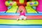 A boy enjoys jumping and bouncing in an inflatable castle at his birthday party