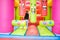 A boy enjoys jumping and bouncing in an inflatable castle at his birthday party