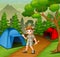 Boy in explorer outfit camping out in nature