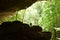 A boy exploring a cave