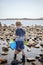 Boy exploring tide pools on New Hampshire coast