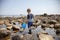 Boy exploring tide pools on New Hampshire coast